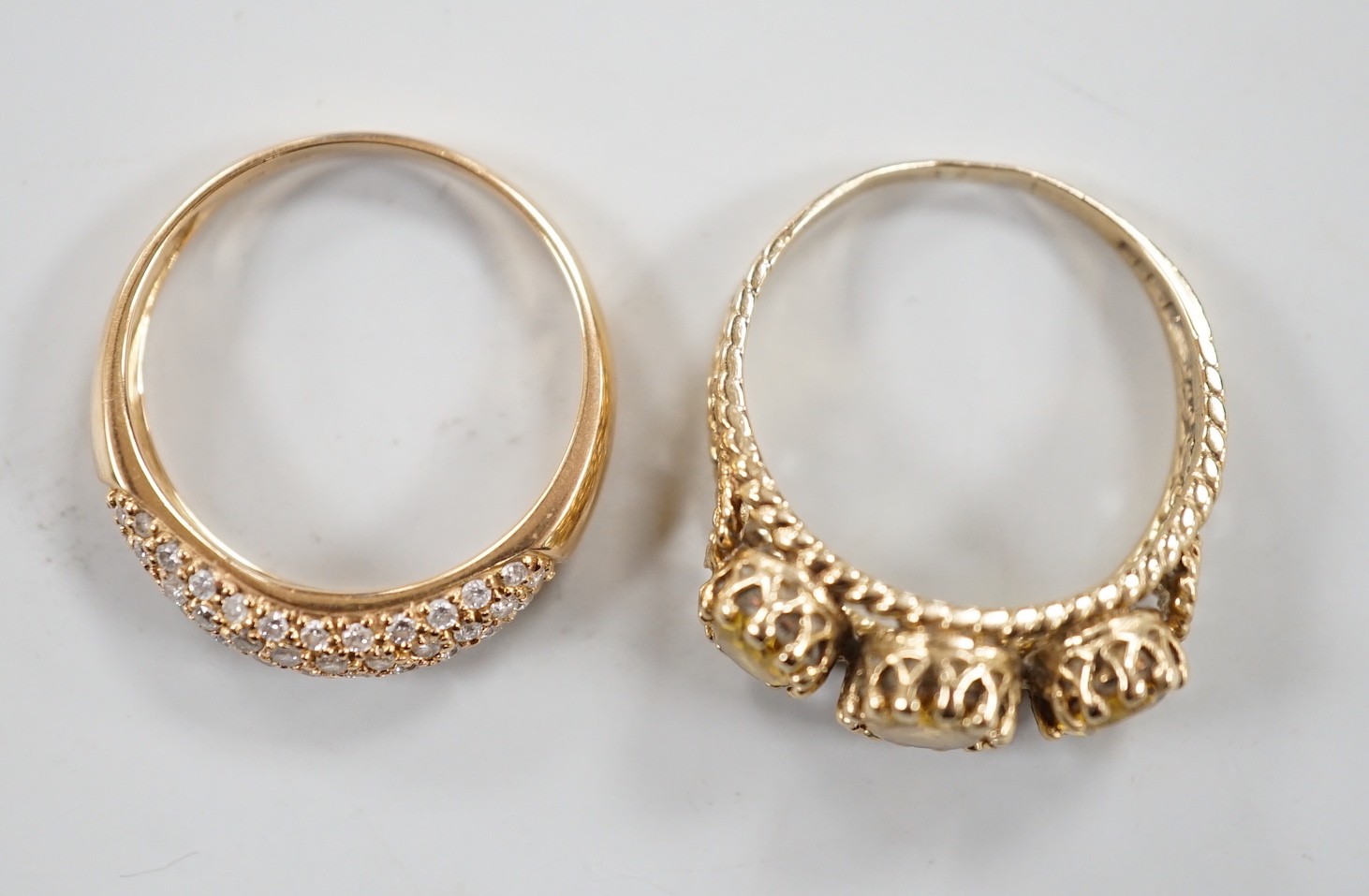 A modern 9ct gold and three stone citrine ring, size Q, gross weight 4.7 grams and a modern 18ct gold and pave set diamond chip ring (stone missing), gross weight 2.8 grams.